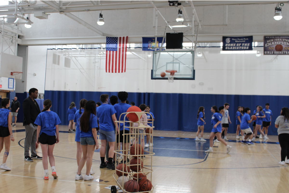 Eighth graders battle each other in Spikeball during their indoor field day.